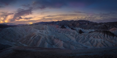Zabriskia panorama during morning twilight, with moon